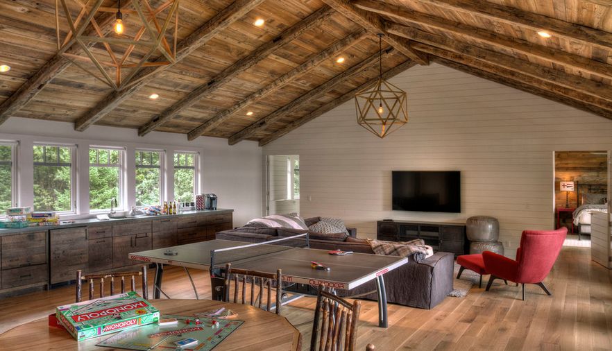 Media center room with rustic vaulted ceiling